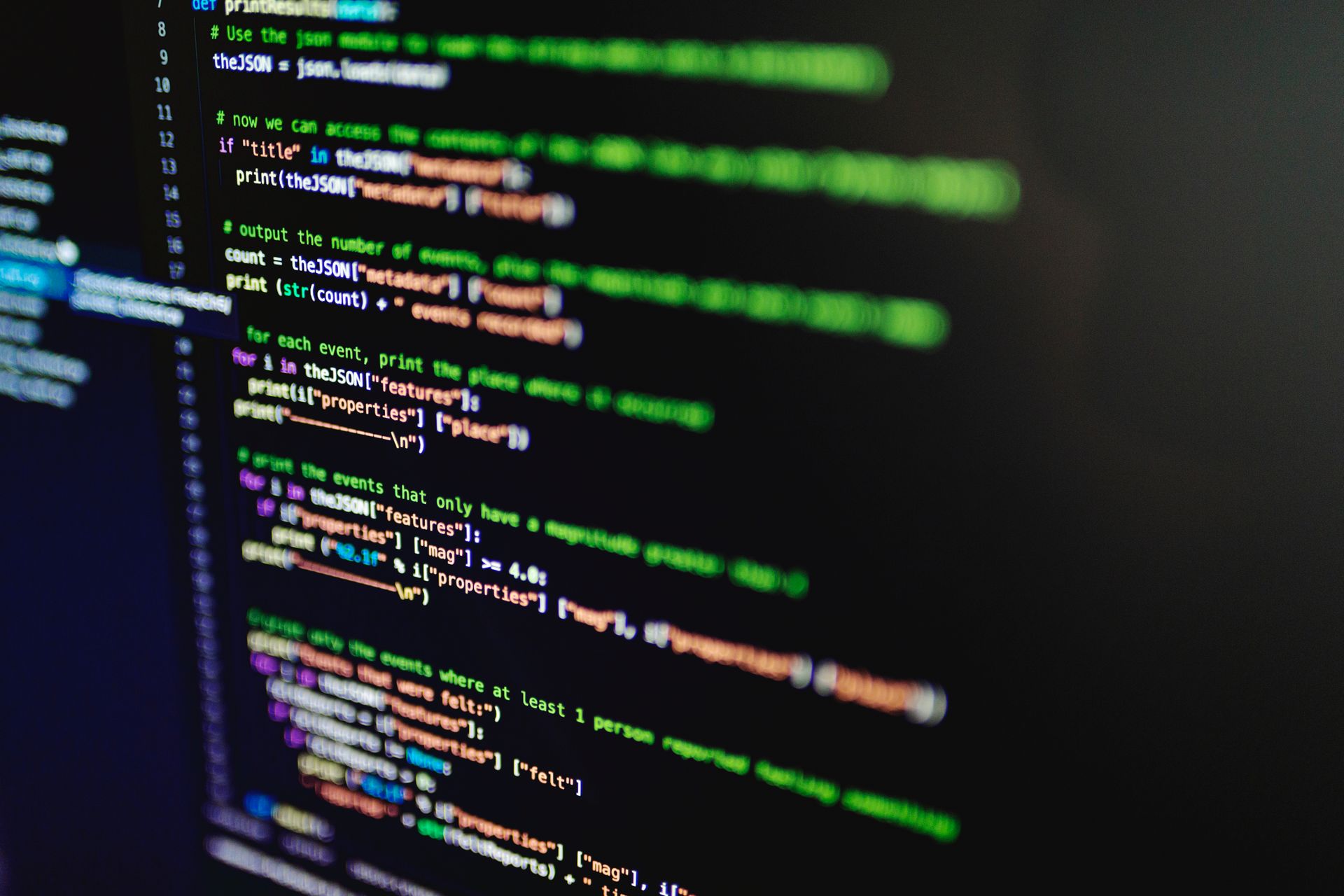 A computer with code showing on the screen